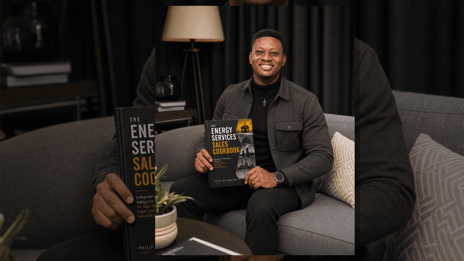 Philip Jojo Montford holding The Energy Services Sales Cookbook.